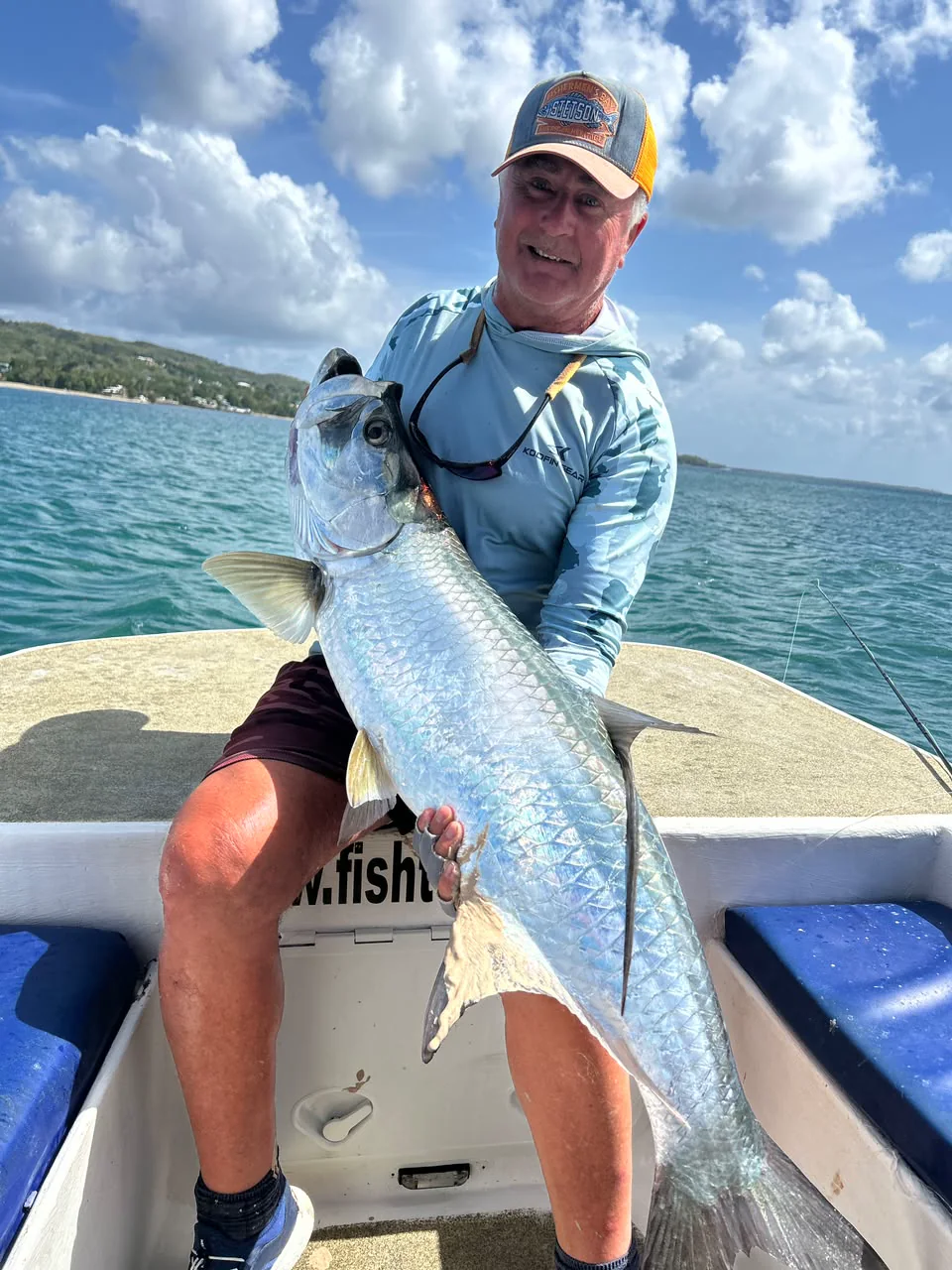 A big tarpon held alongside the boat